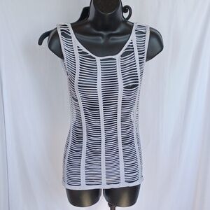 Women's shredded white rave muscle shirt, looks great over a sport bra or bikini